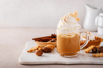 Pumpkin spice latte topped with whipped cream and cinnamon