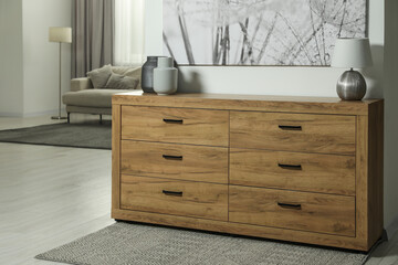 Cozy room interior with chest of drawers, painting, sofa and decor elements, space for text