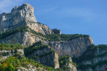 Naklejka premium Birds of prey flying over the rocks of Pyrenees mountains in Ordesa National Park, Spain