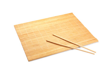 Bamboo mat and chopsticks isolated on white