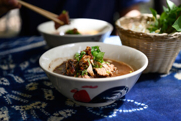 Rice noodles soup with pork and vegetables, Thai boat noodles style