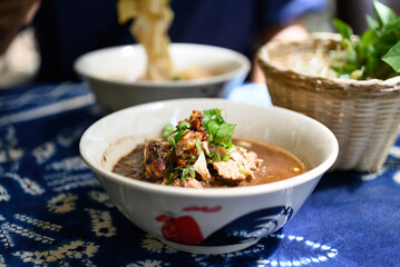 Rice noodles soup with pork and vegetables, Thai boat noodles style