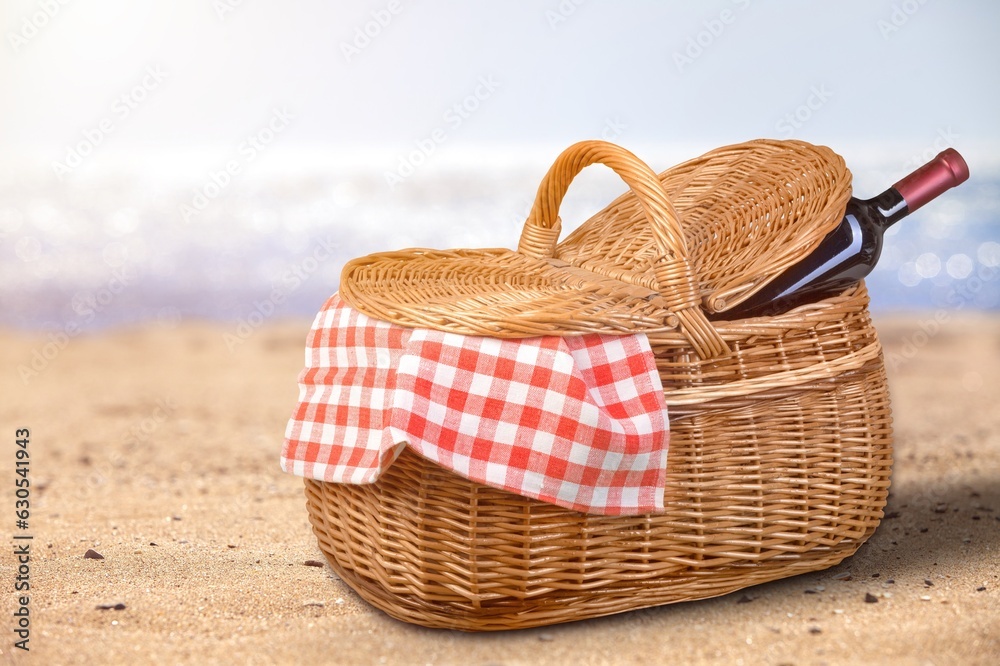 Poster Classic picnic basket with a wine bottle