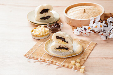 Fototapeta na wymiar Baozi or Chinese Steamed Buns is a type of yeast-leavened filled bun in various Chinese cuisines.