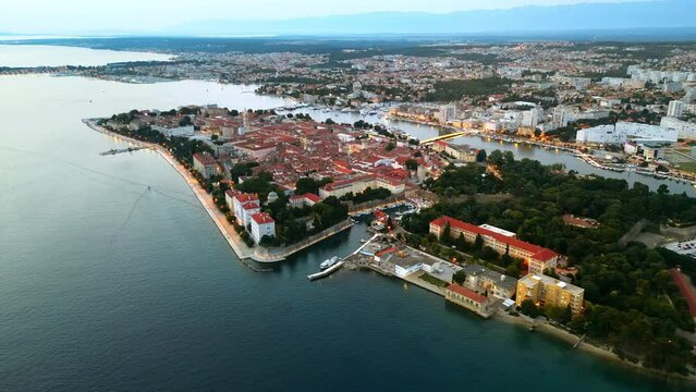 Aerial drone view of Zadar in evening, Croatia. Historical city centre with old buildings and water channels