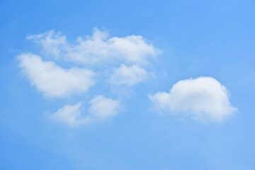 beautiful blue sky and white fluffy group of clouds with sunrise in the morning, natural background
