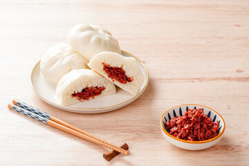 Baozi or Chinese Steamed Buns is a type of yeast-leavened filled bun in various Chinese cuisines.