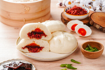 Baozi or Chinese Steamed Buns is a type of yeast-leavened filled bun in various Chinese cuisines.