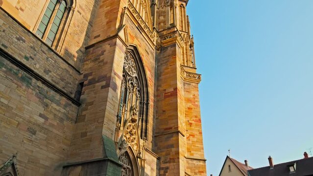 Large Roman Catholic St Martin's Church with Gothic architecture in Colmar. Old medieval stone building church with medieval statues in Colmar Town in the Grand Est of France