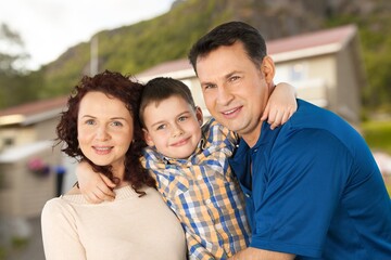 Obraz premium Happy young family near new house have fun