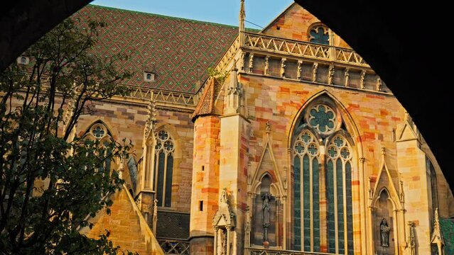 Large Roman Catholic St Martin's Church with Gothic architecture in Colmar. Old medieval stone building church with medieval statues in Colmar Town in the Grand Est of France