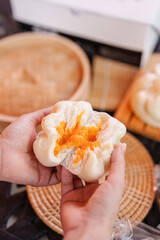 Obraz na płótnie Canvas Baozi or Chinese Steamed Buns is a type of yeast-leavened filled bun in various Chinese cuisines.