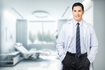Portrait of friendly male doctor posing in clinic