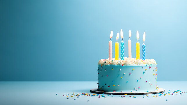 birthday cake with 6 (six) candles on pastel blue background with copy space