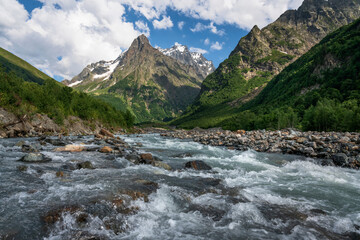 View of the Dombay-Ulgen River in the mountains of the North Caucasus near the village of Dombay on a sunny summer day, Karachay-Cherkessia, Russia