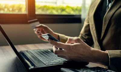 Businessman using credit card, Businessman or entrepreneur working, Online shopping, e-commerce, making transaction using mobile bank application. online payment, secure transactions for e-commerce