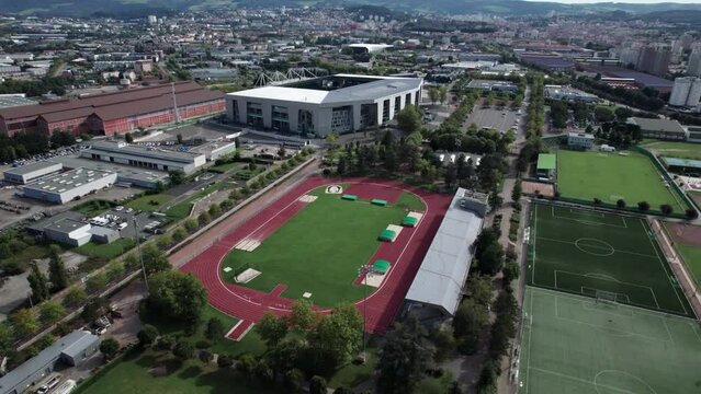 Drone shot of Saint Etienne Stadium Geoffroy Guichard with the city in the background