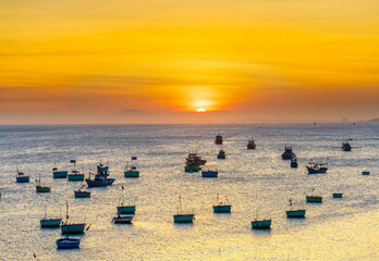 Mui Ne fishing village in sunset sky with hundreds of boats anchored to avoid storms, this is a beautiful bay in central Vietnam