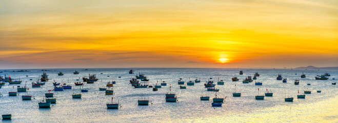 Mui Ne fishing village in sunset sky with hundreds of boats anchored to avoid storms, this is a beautiful bay in central Vietnam