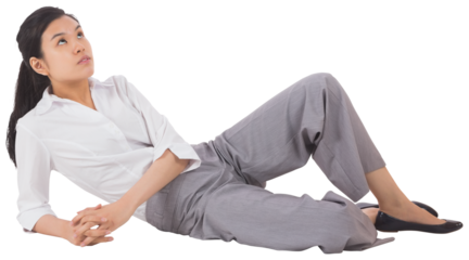 Digital png photo of happy asian businesswoman lying down on transparent background