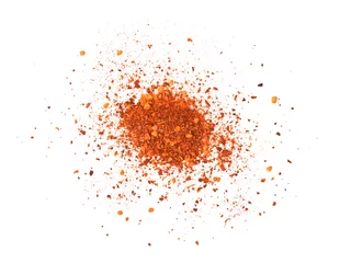Foto auf Acrylglas Scharfe Chili-pfeffer Crushed red cayenne pepper, dried chili flakes and seeds pile isolated on white background