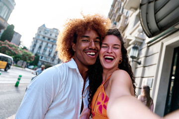 tourists couple of tourists taking selfie in Barcelona, Spain