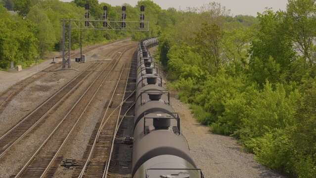a long strin of tanker cars traveling the railroad tracks in Pennsylvania view from above