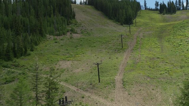 Aerial above chair lifts in summer in Idaho on ski resort near Kellogg
