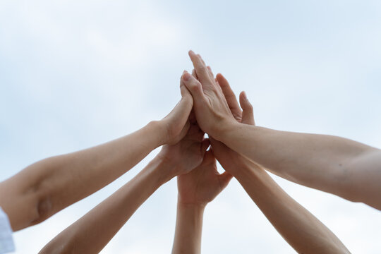 Panoramic Teamwork,empathy,partnership and Social connection in business join hand together concept.Hand of diverse people connecting.Power of volunteer charity work,Stack of people hand.
