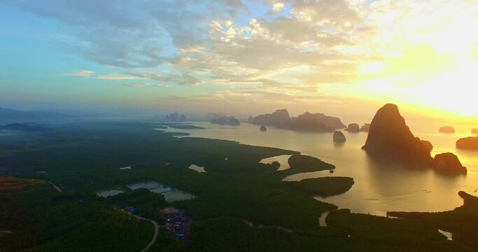 .Aerial view fantasy cloud scape in sunrise above Samed Nang Chee, Phang Nga .Imagine a fantasy bright red sky at sunrise from a bird's eye view. .archipelago background. sky texture