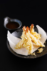 Shrimp tempura Japanese food isolated on a black background - 630591345