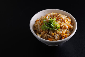 Japanese fried rice yakimeshi isolated in black background