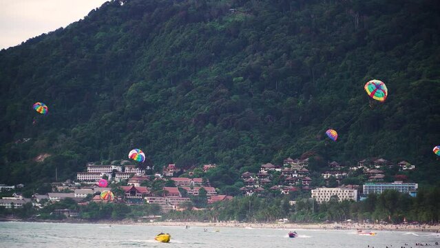 Patong beach scene with colorful parasailing, Phuket, Thailand. Static