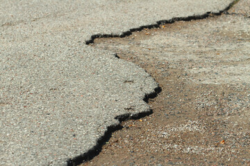 Cracked road surfaces.