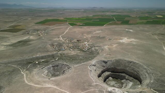 Drone footage of sinkhole formations, deep valleys, natural scenery on Earth. Erosion and the environment. Konya Karapinar district