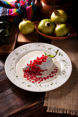 Chile en Nogada, Typical dish from Mexico. Prepared with poblano chili stuffed with meat and fruits and covered with a walnut sauce. Named as the quintessential Mexican dish for national holidays.