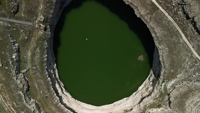 Drone footage of sinkhole formations, deep valleys, natural scenery on Earth. Erosion and the environment. Konya Karapinar district