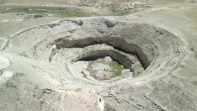 Drone footage of sinkhole formations, deep valleys, natural scenery on Earth. Erosion and the environment. Konya Karapinar district
