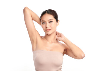 Obraz premium Beautiful Young Asian woman lifting hands up to show off clean and hygienic armpits or underarms on white background, Smooth armpit cleanliness and protection concept