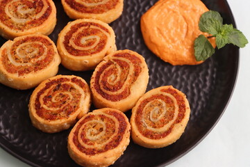 Pinwheel Samosa, are small bite sized snacks in the shape of a pinwheel and filled with a spicy potato stuffing, baked or fried, starter or appetizer