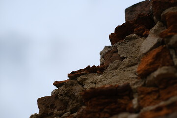 A fragment of red, broken bricks.