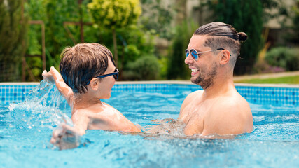 Dad and son in the pool
