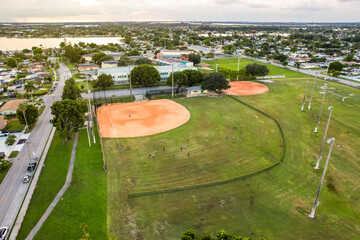 Aerial of a baseball field and makeshift soccer field inside Norman and Jean Reach Park on Palm...