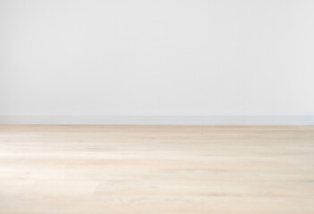 Beige oak floor and light wall for room background design. The concept of a mockup of empty space in an apartment.