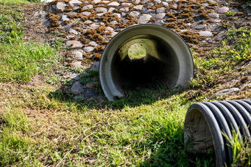 Trough the pipe. Stormwater and road infrastructure ditch