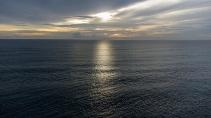Cinematic aerial view of sunset waves off the coast of Aceh, Indonesia.