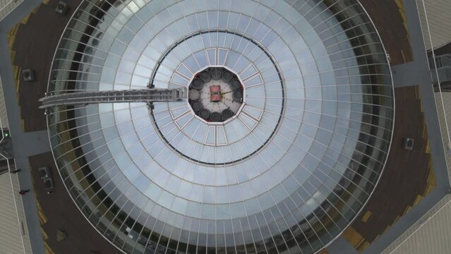 Top-down spiral shot of the Reykjav&iacute;k Perlan Museum with large water tanks