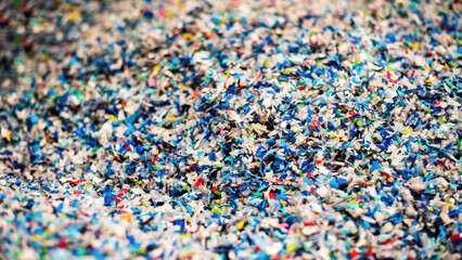 Shredded plastic garbage at waste recycling factory