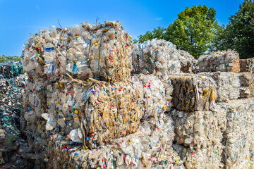 Cubes of compressed plastic garbage at a waste recycling factory
