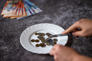 Kazakh money. Tenge coins. Coins on plates